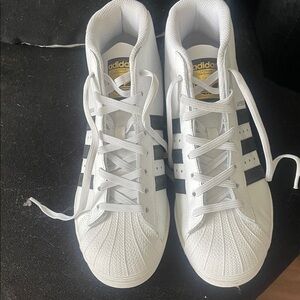 Super Star adidas White Sneakers with Black Stripes and Gold Tongue Logo